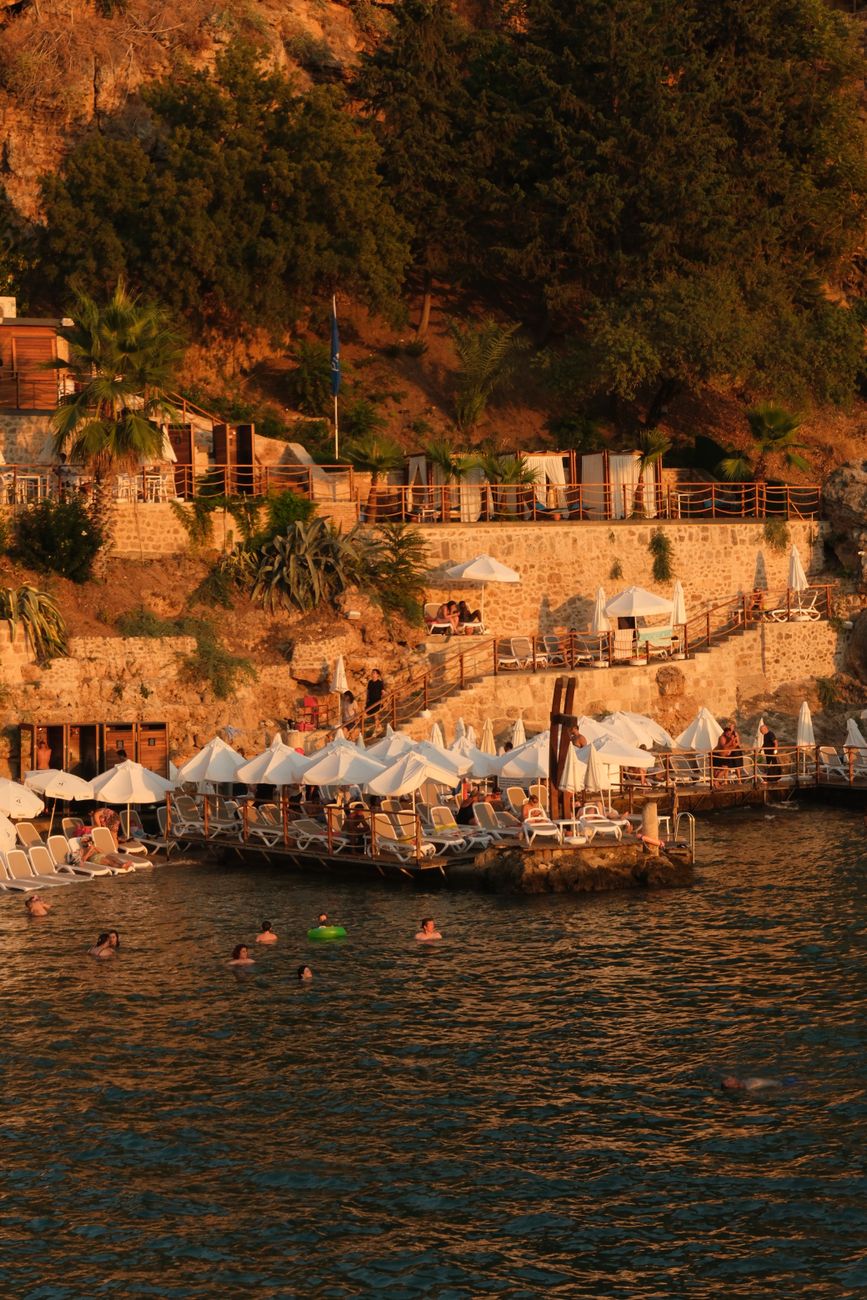 Mediterranean cliffside terrace villa at golden hour